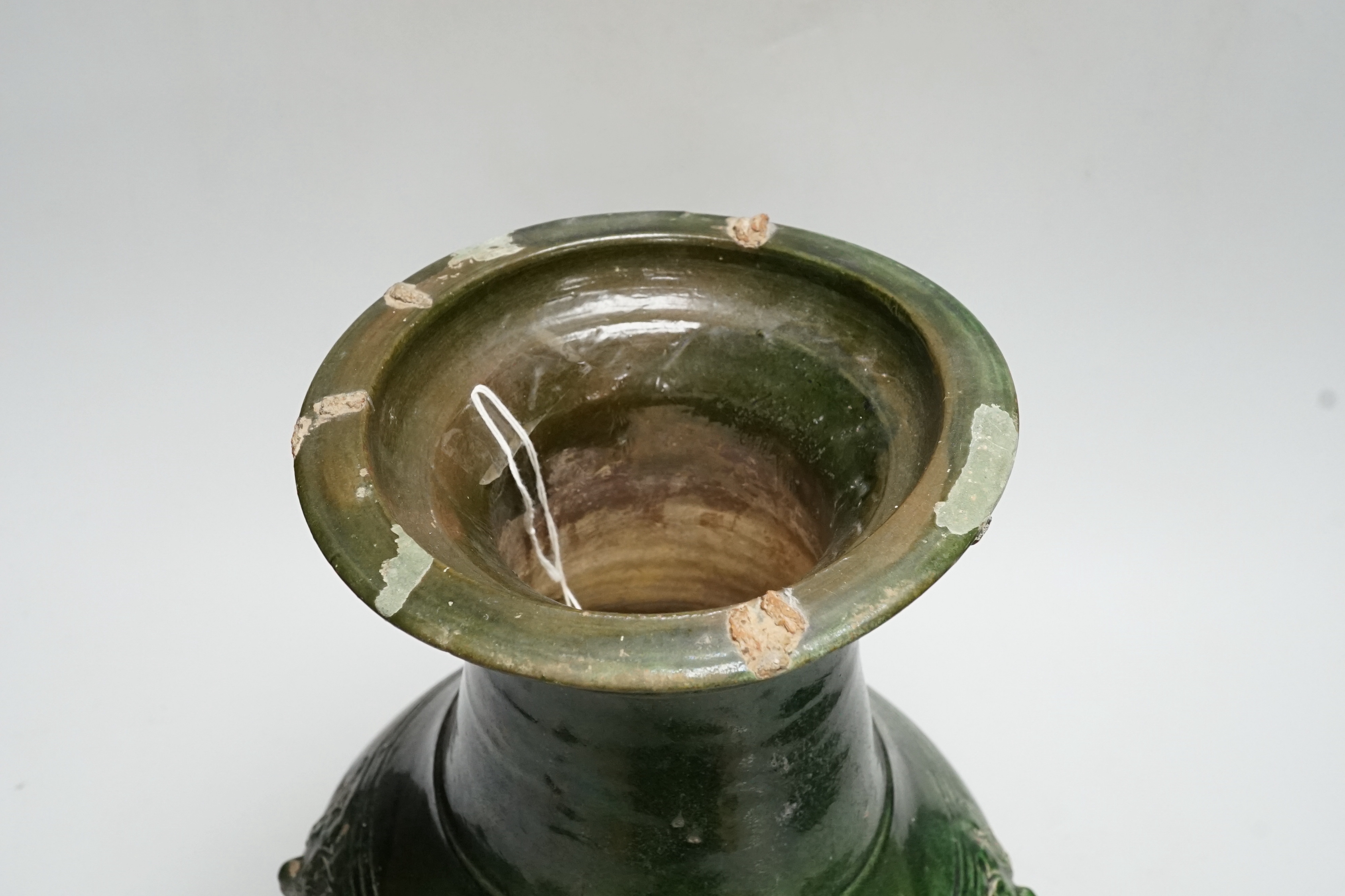 A Chinese Han dynasty dark green glazed ribbed baluster vase, hu, 34cm